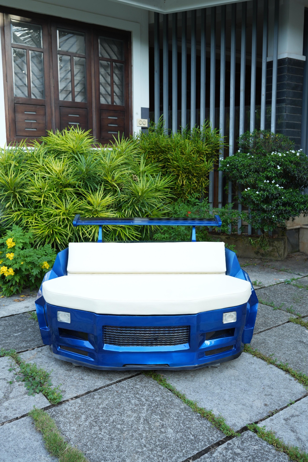 Luxury automotive-inspired furniture and race-seat lounge